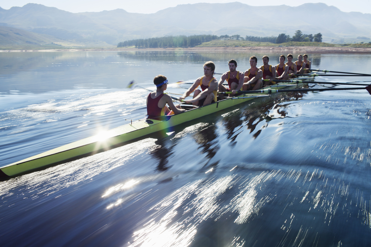 Team of people rowing 