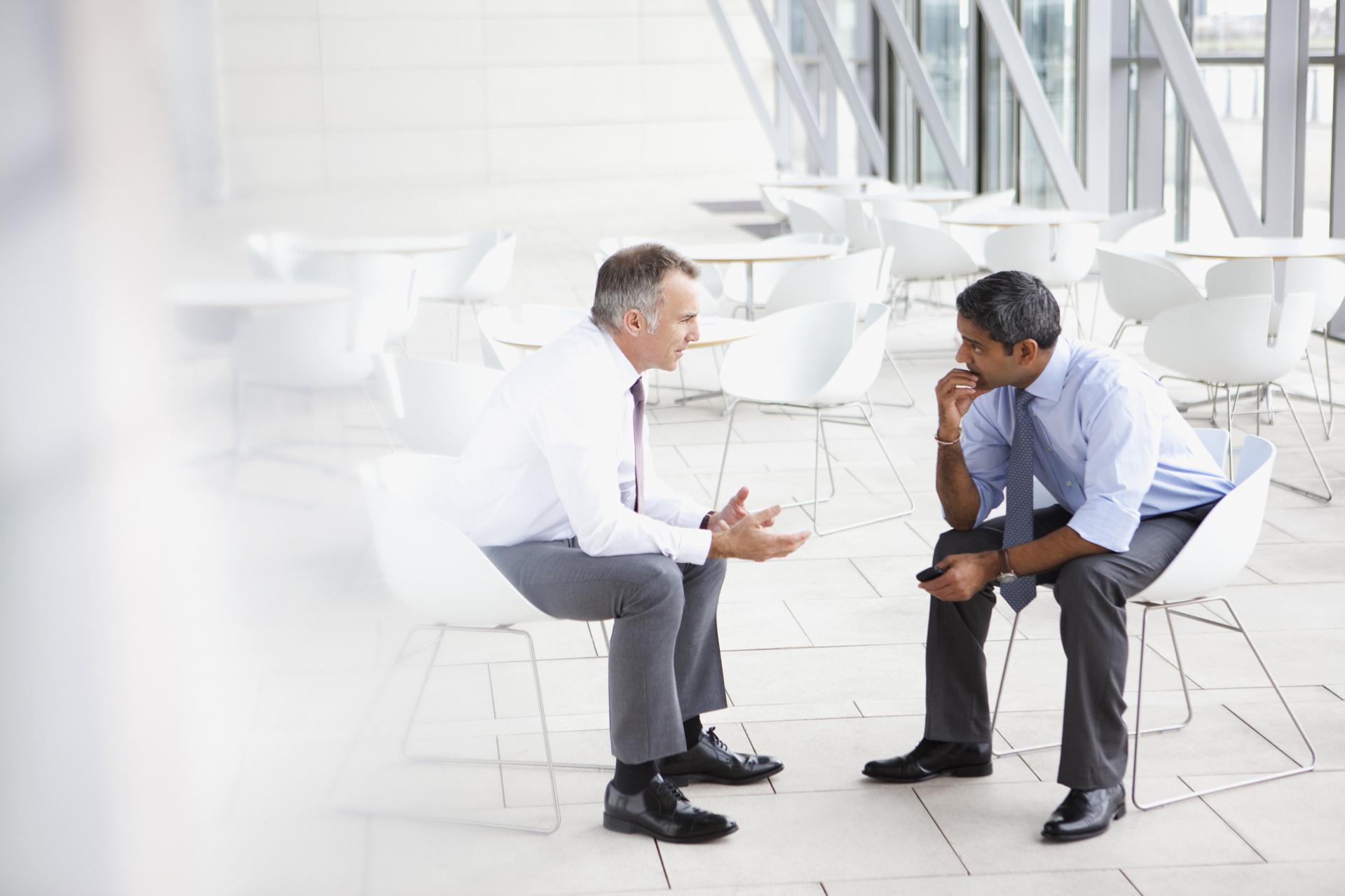 two people talking in office