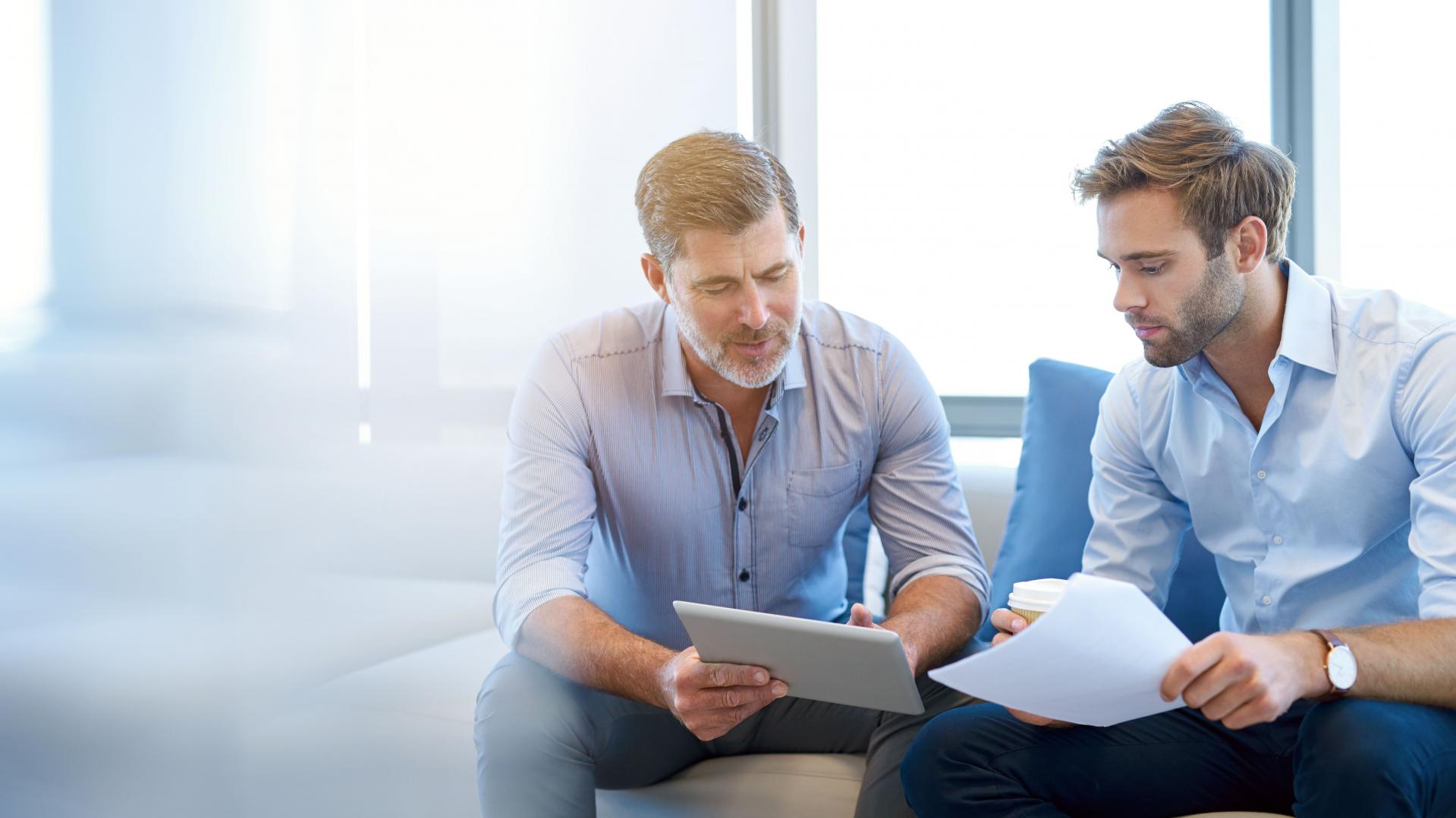 Mentor Talking to Young Employee