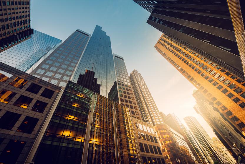 Buildings with sunrise coming through