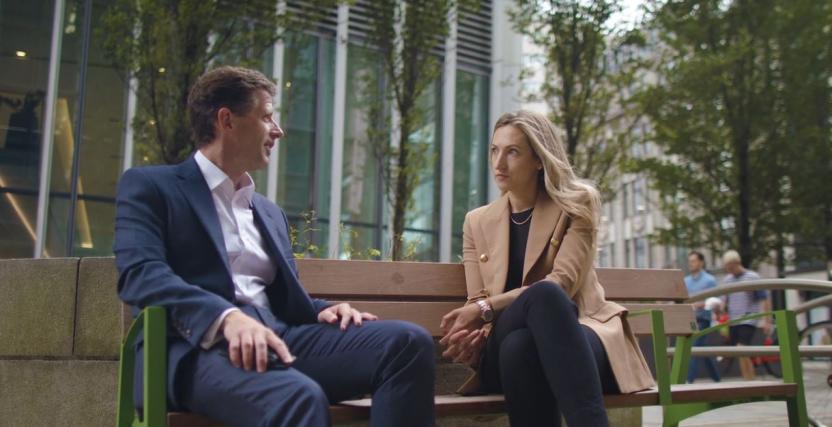 Peter Smith talking to Alex on a bench outside the London office